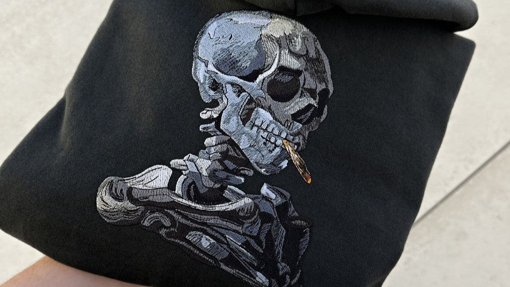 SKULL OF A SKELETON WITH BURNING CIGARETTE