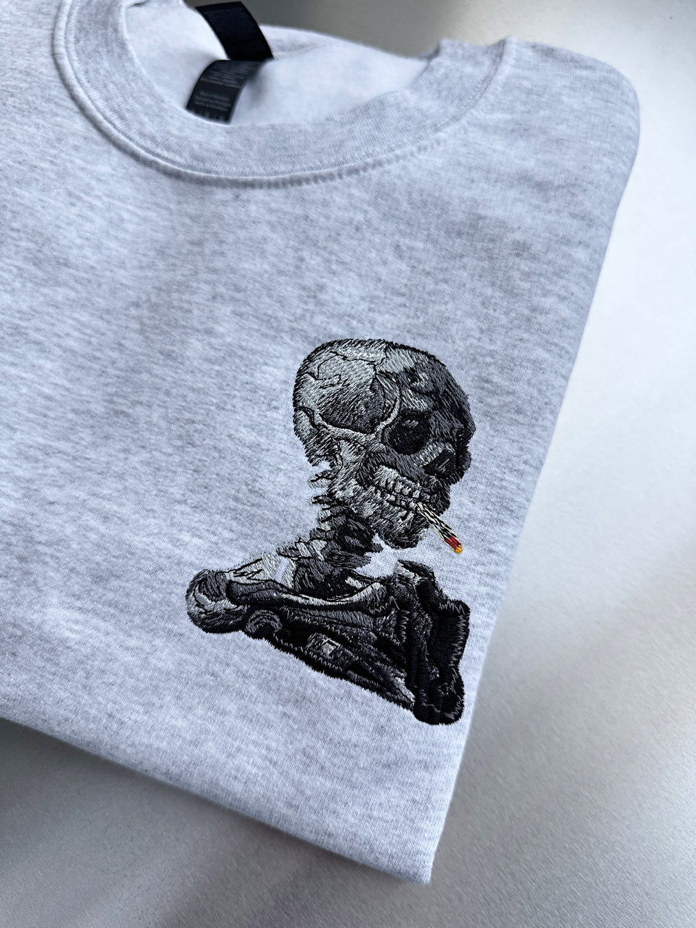SKULL OF A SKELETON WITH BURNING CIGARETTE (SMALL)