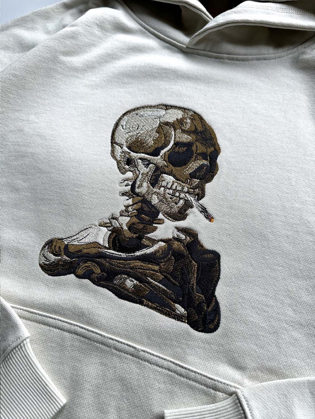 SKULL OF A SKELETON WITH BURNING CIGARETTE