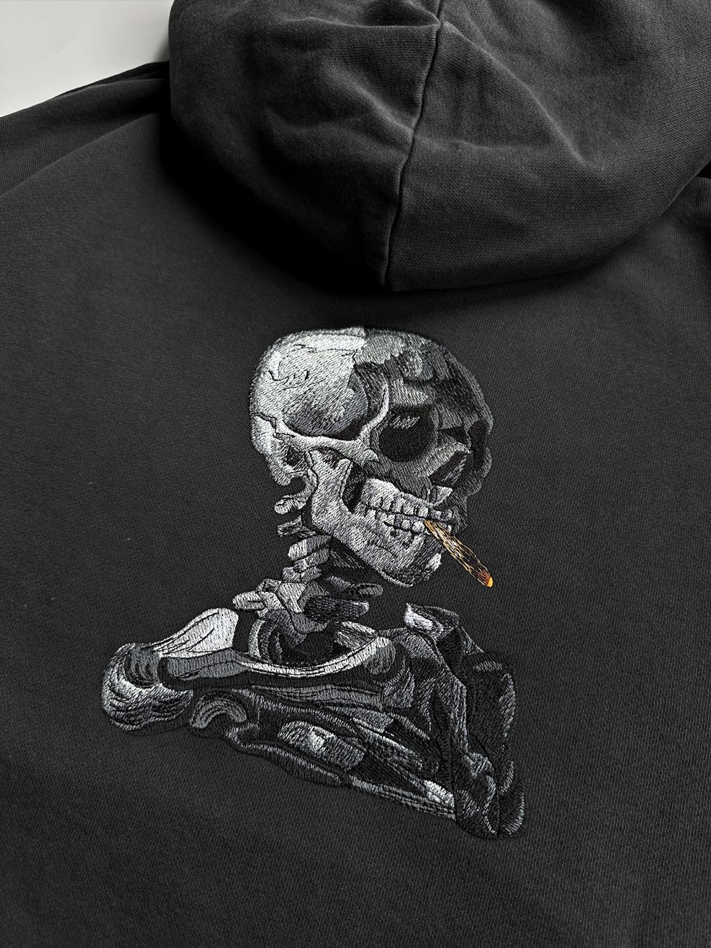 SKULL OF A SKELETON WITH BURNING CIGARETTE