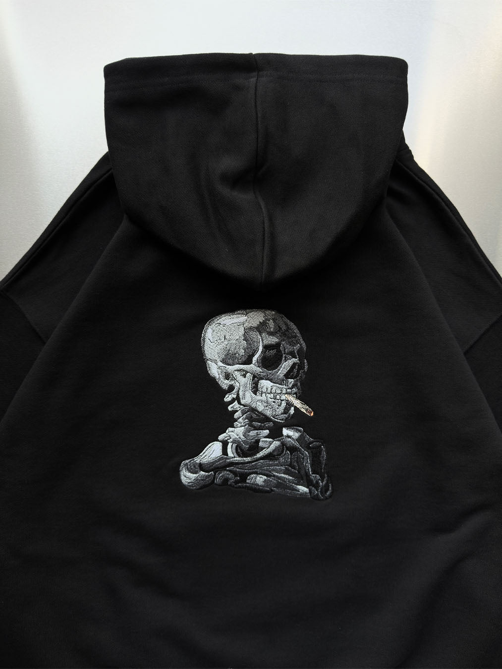Skull of a Skeleton with Burning Cigarette