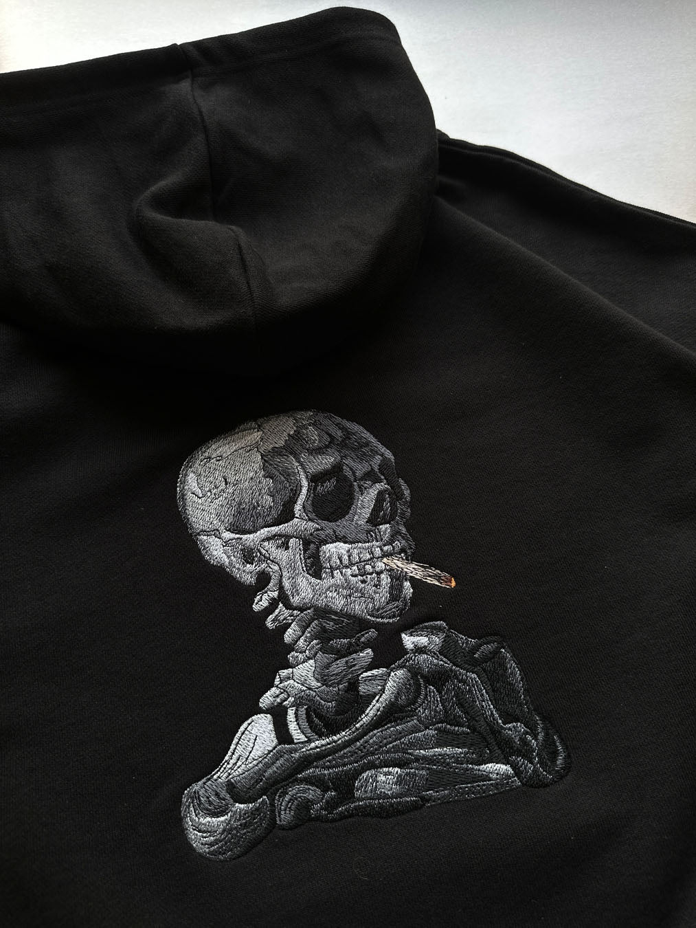 Skull of a Skeleton with Burning Cigarette